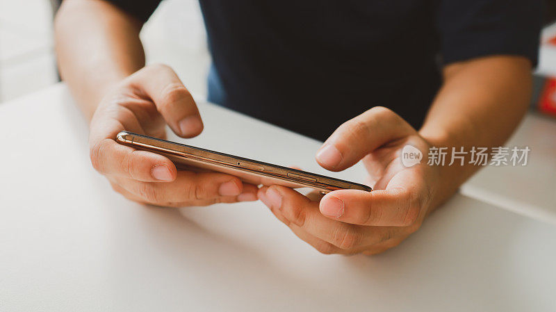 Man playing game on mobile phone. gamer boy playing video games holding Smartphone working mobile devices. cell telephone technology e-commerce concept